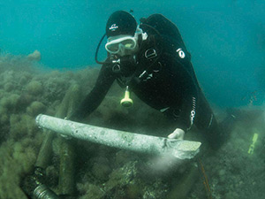Diver collecting concrete sample