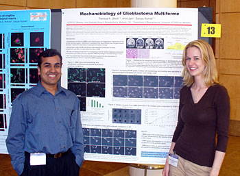Sanjay Kumar and a woman with a poster about glioblastoma multiforme
