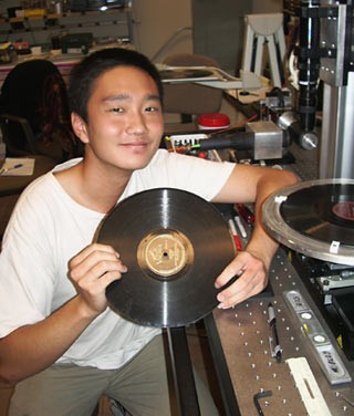 Henry Wang holding a record