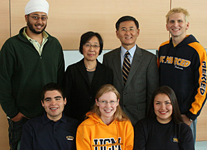 Chancellor Kang and wife Mia pose with students for the chancellor's annual holiday card. Photo courtesy of UC Merced. 