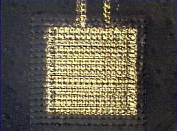 Close-up of capacitor, showing two layers of gold separated by 100nm of polyimide.