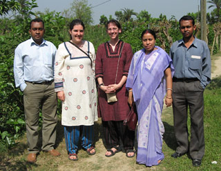 Johanna Mathieu and Susan Amrose (physics grad student) pose with the staff of the Bangladeshi Rural Advancement Committee's Jessore Office, March 2007. 