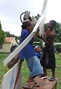 Community members repairing a wind turbine. Photo courtesy Christian Casillas 