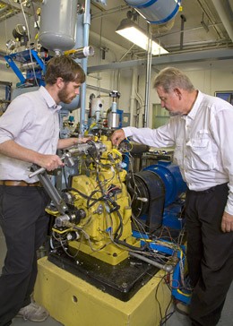 Post-doc Hunter Mack (left) and ME professor Robert Dibble at work in the Combustion Analysis Laboratory in Hesse Hall on a single-cylinder Waukesha CFR engine, an industry prototype for performing research on internal combustion engines. PHOTO CREDIT: ROY KALTSCHMIDT 