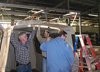 Barney Smits (left) and two fellow BART engineers build a model car for fire testing. After they built the car, it was disassembled and trucked to Worcester Polytechnic Institute in Massachusetts to do the fire testing. BART stations are also routinely evaluated to determine their fire load potential. PHOTOS COURTESY BAY AREA RAPID TRANSIT