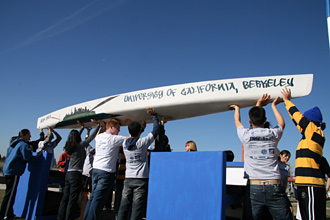 Members of the Berkeley Engineering Concrete Canoe Team show off Bear Area, the 230-pound vessel they rode to their first national championship since 1992. COURTESY CONCRETE CANOE TEAM