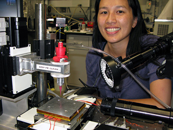 PRECISION MANUFACTURING: Christine Ho with the printer dispenser tool she uses to fabricate microbatteries. RACHEL SHAFER