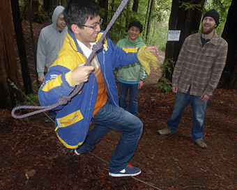 STRIKING A BALANCE: Jerry Chang navigates a ropes course at Berkeley’s first-ever LeaderShape Institute, as fellow engineering students look on. The event emphasized team-building and self-discovery. COURTESY GALVIN MATHIS