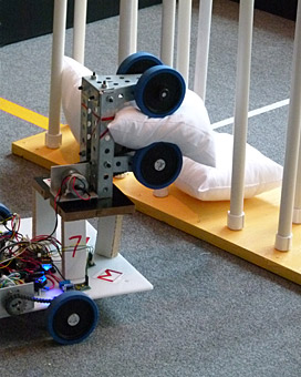 I, ROBOT: In the final competition, one of Oakland Tech’s robots carries a pillow toward a PVC goal. Teams spent seven weeks designing, constructing and perfecting their robots, culminating in a lively matchup that left some robots scoring, and others, fumbling. HAMILTON NGUYEN