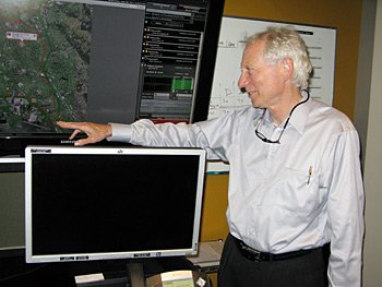 COMMAND AND CONTROL: In the computer control room of his company’s headquarters, ShotSpotter co-founder Robert Showen (B.S.’65 EECS) explains how potential gunshot incidents are displayed and logged within a specialized software interface. Showen, who is partially retired, still writes patents and makes improvements to the system’s acoustic signal processing. RACHEL SHAFER