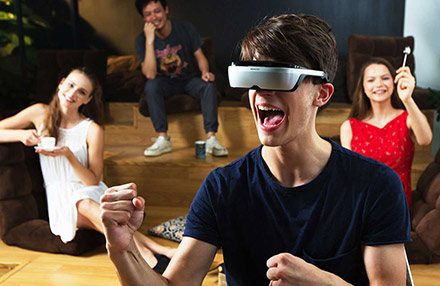 Young man wearing VR goggles