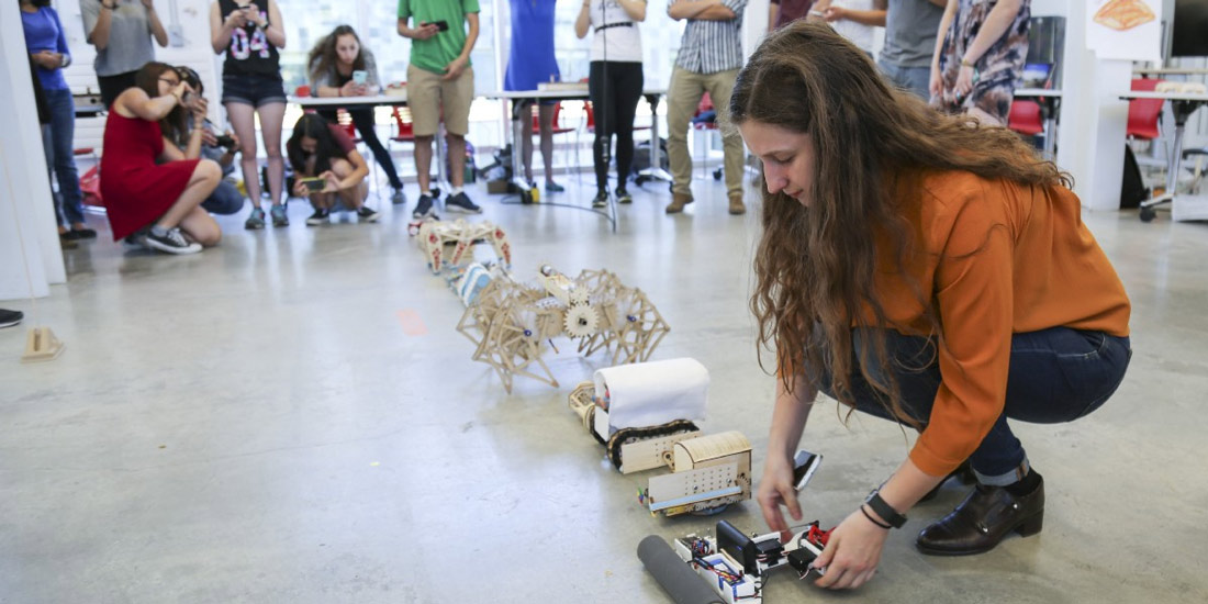 Students at the starting line of the Bluetooth-controlled vehicle race