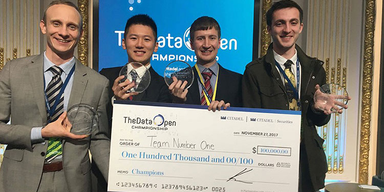 Winning students Eric Munsing, Allen Tang, Soeren Kuenzel and Jake Soloff with their prize check