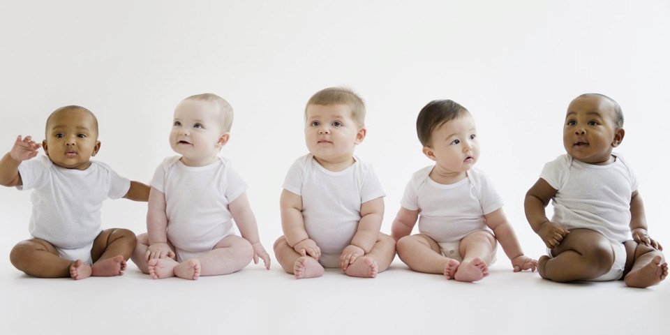 Five babies of different races in a row