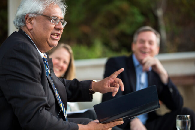 Dean Shankar Sastry at an outdoor Dean's Society gathering, with Diane Greene and Paul Jacobs.