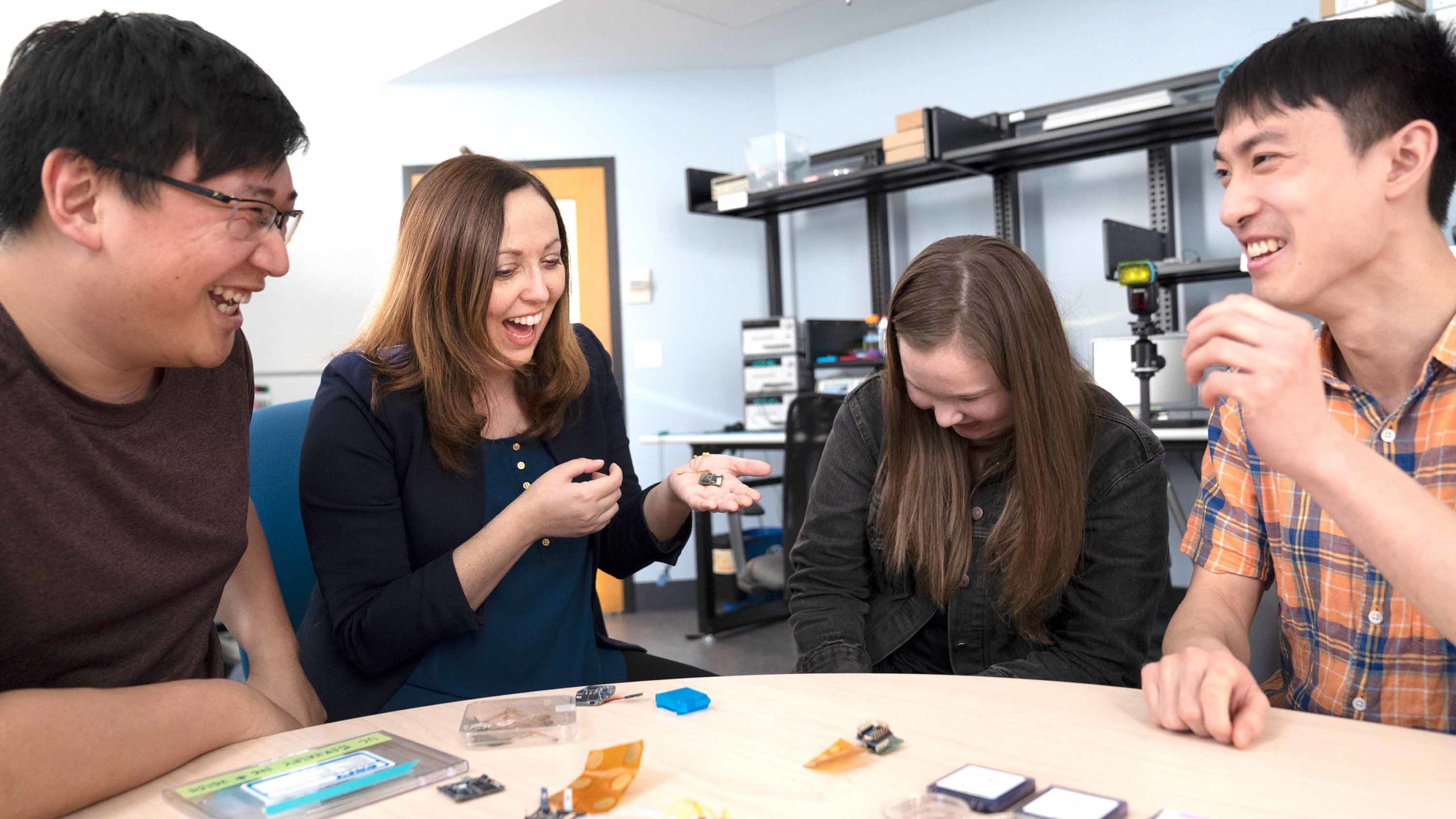 EECS professor Rikky Muller with students