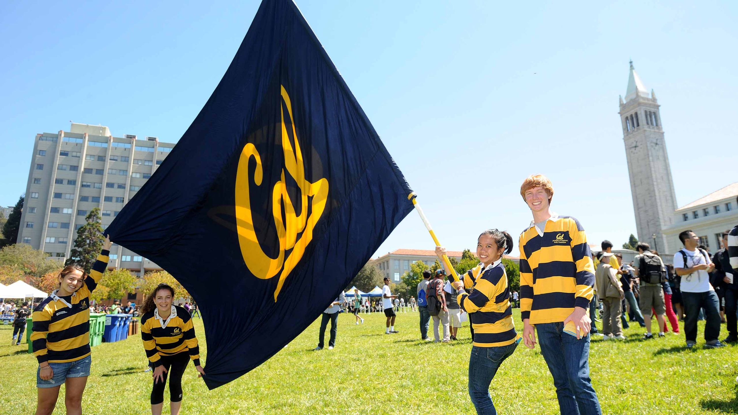 Rally Committee waving Cal flags on Memorial Glade