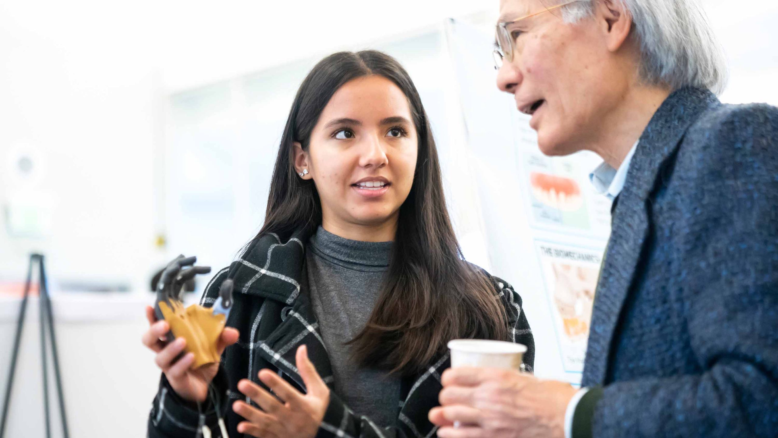 A student demonstrates her project prototype at the Jacobs Institute's Design Showcase.