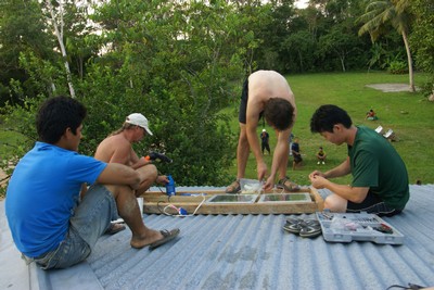 Installing solar panels on a school roof