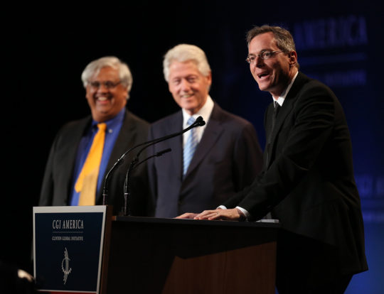 Paul Jacobs onstage with Dean Shankar Sastry and former President Bill Clinton