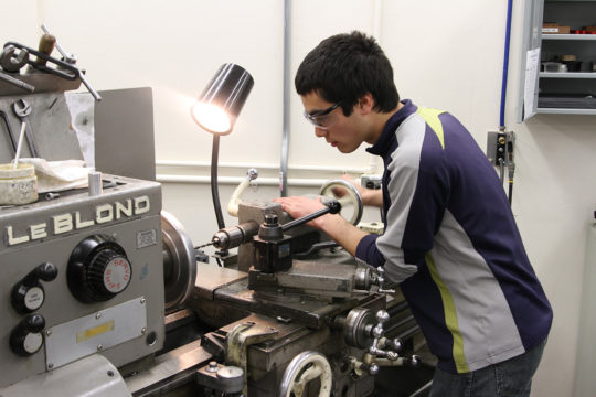 Student in machine shop