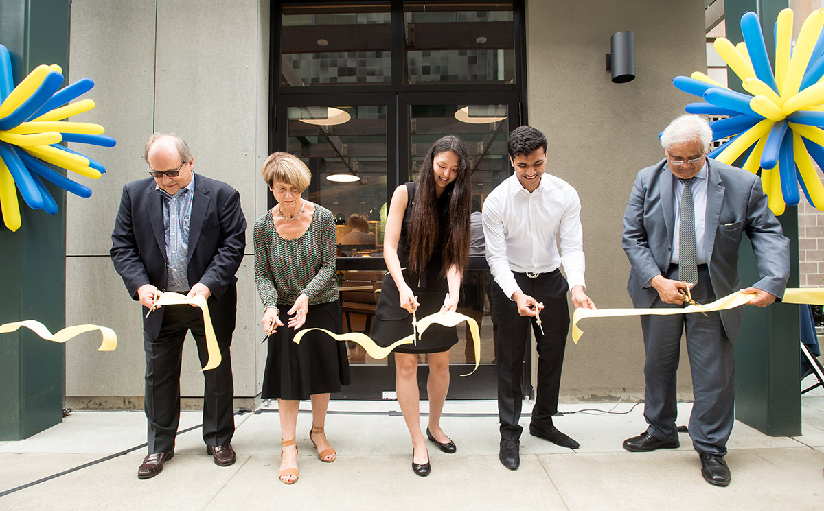 Cutting the ribbon to open the café