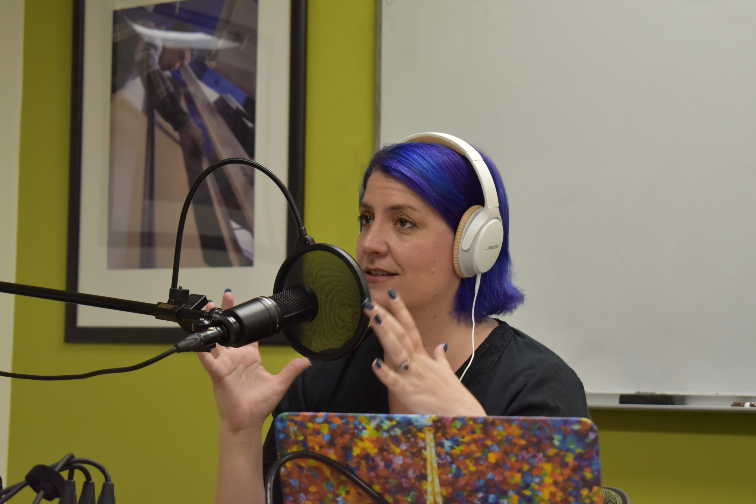 Laura Vogt, podcast host, at the microphone