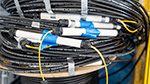 Coiled fiber optic cable