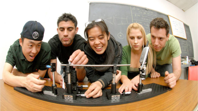 Fisheye view of students at a lab bench