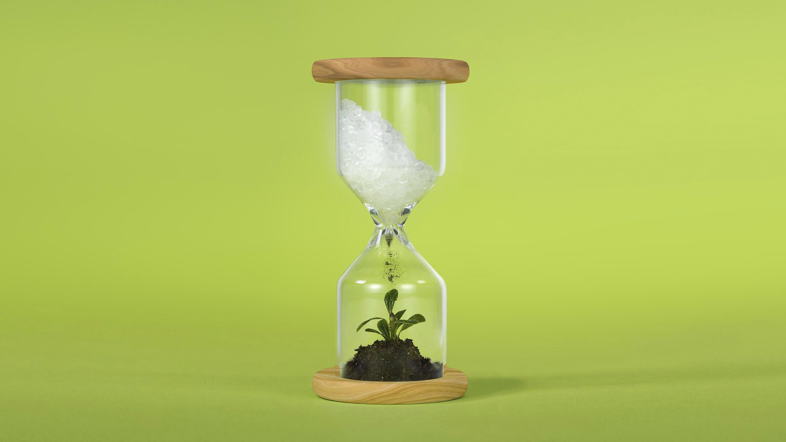 Illustration of hourglass, containing plastic transforming into compost