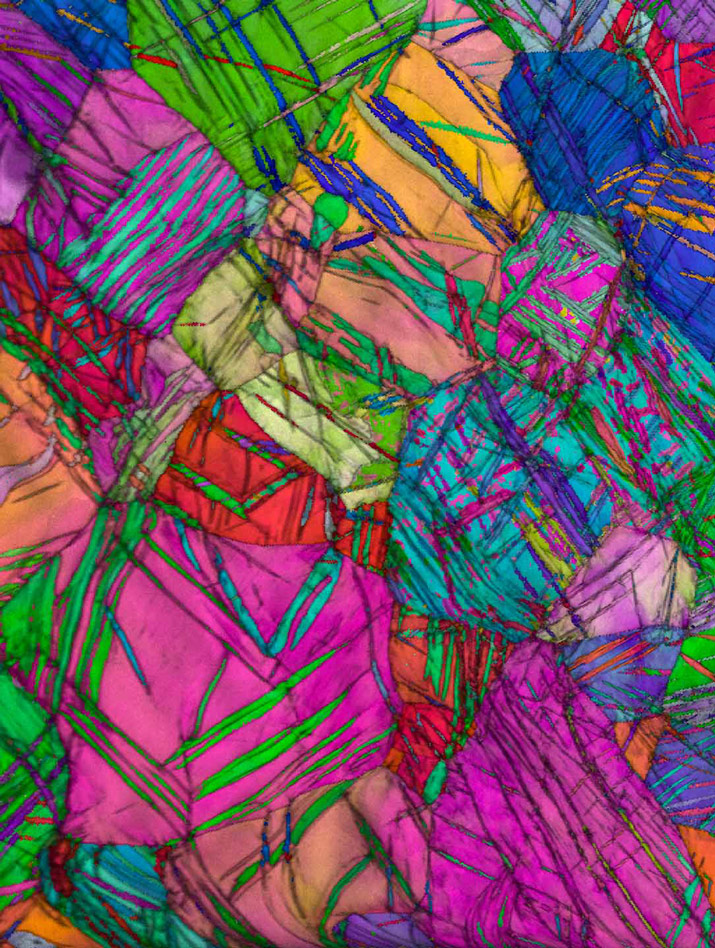 Colorful electron microscope image of pure titanium with a nanotwinned structure.