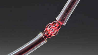 Red dye runs through a VAM-printed trifurcated microtubule model