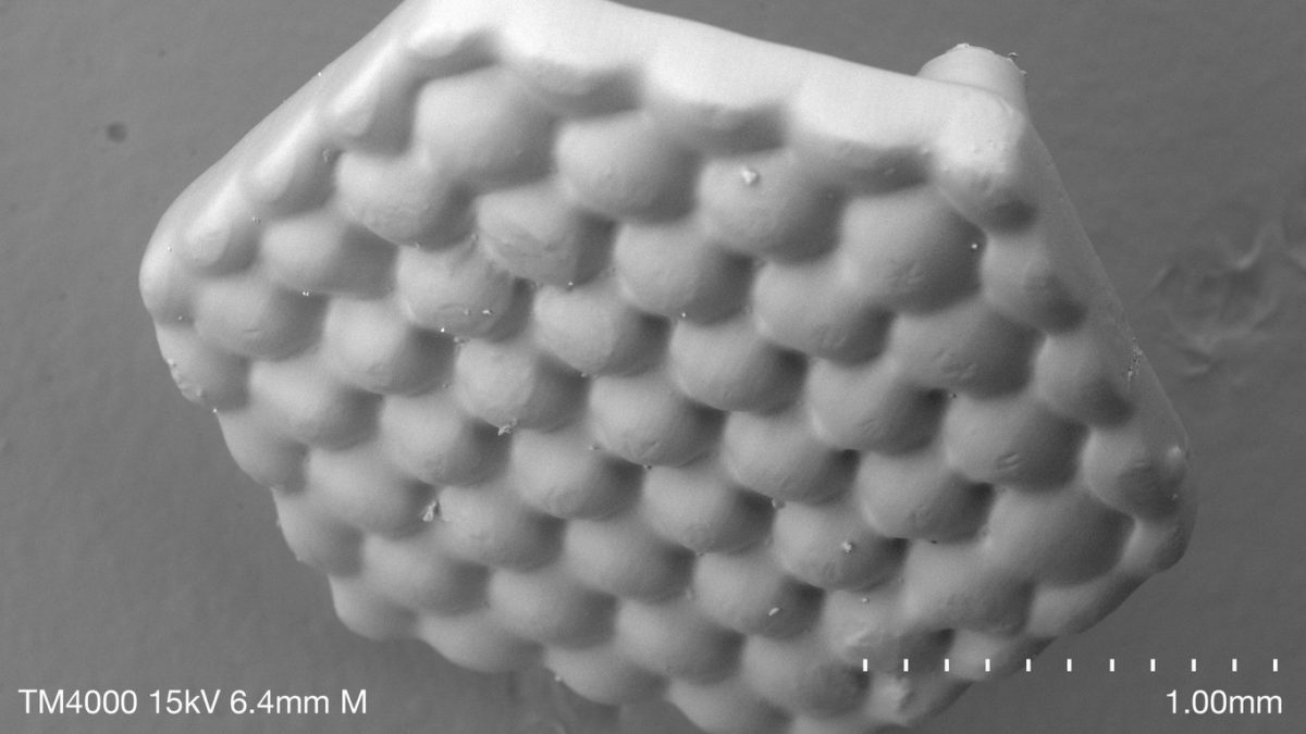 Scanning electron micrograph of a 3D-printed, hexagonal microlens array