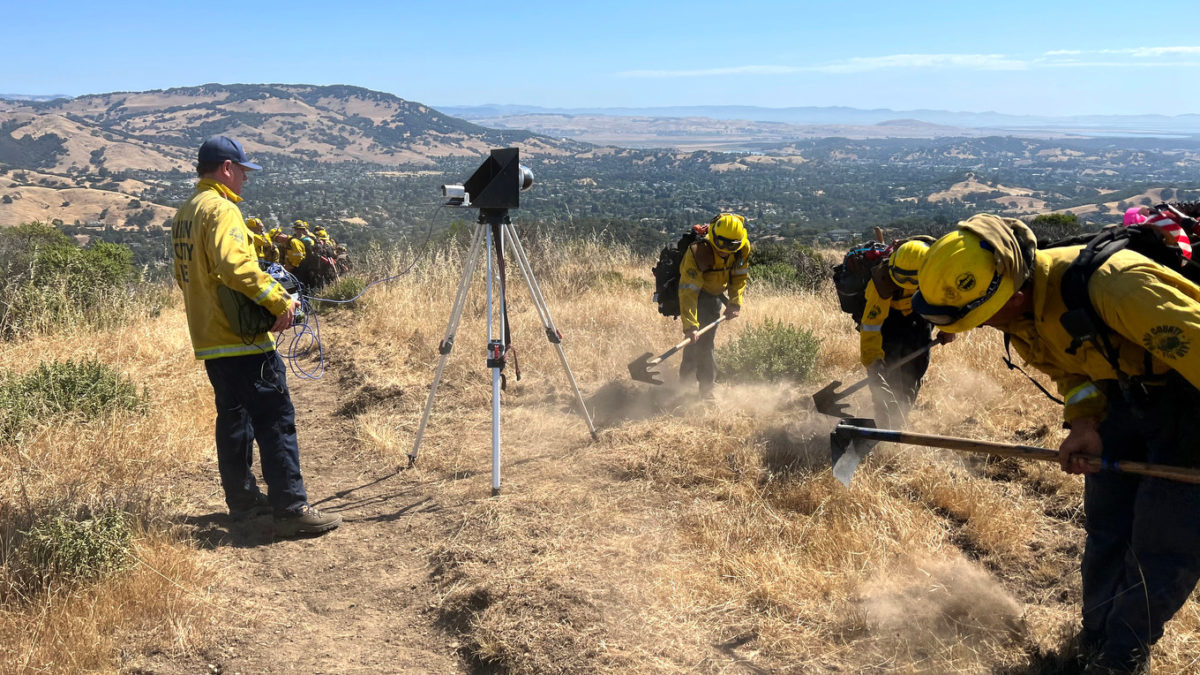 Members of the seasonal Tamalpais Fire Crew, also known as the Tam Crew, create a firebreak so cameras can be set up to capture live video feeds of smoke and fire