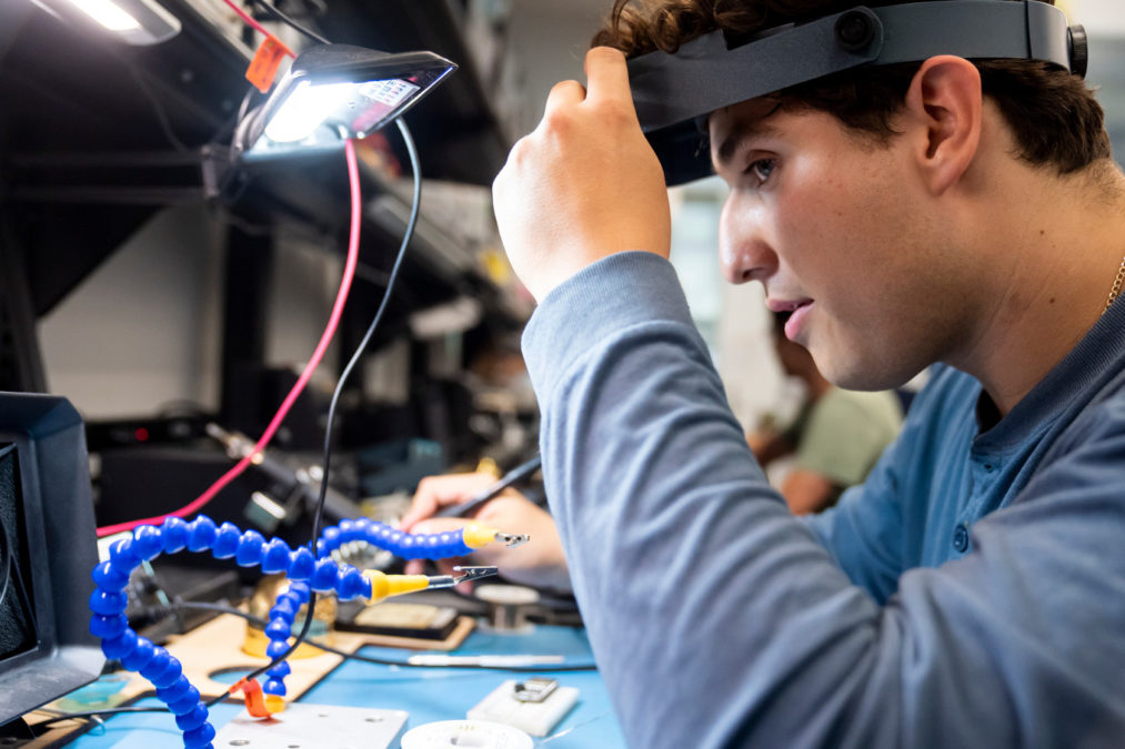 A T-PREP student builds a prototype at the Jacobs Institute of Design Innovation