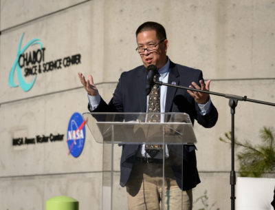Center Director Eugene Tu speaks during the NASA Experience opening ceremony at the Chabot Space and Science Center in Oakland, California.