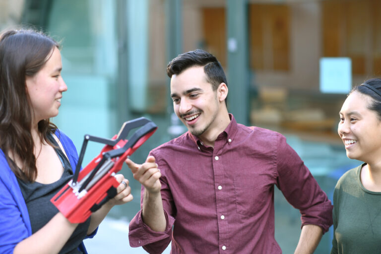 Students with a prosthetic hand