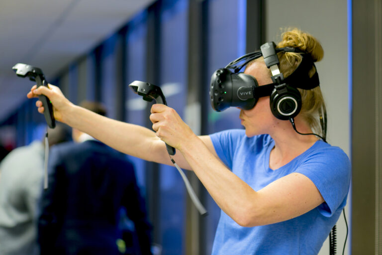 Woman maneuvering while wearing VR gear