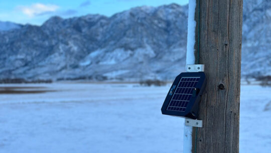 A picture of Gridscope attached to a utility pole in a snowy mountainous area.  (Photo courtesy of Gridware)