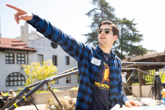 Student pointing out directions during Cal Day