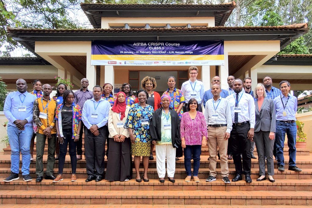 A group shot of scientists at Innovative Genomics Institute's CRISPR course in Kenya. A blue banner reads "AfPBA CRISPR Course Class 1."