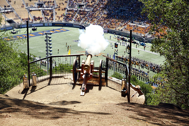 In this archival shot, smoke hangs over the cannon barrel at California Memorial Stadium.