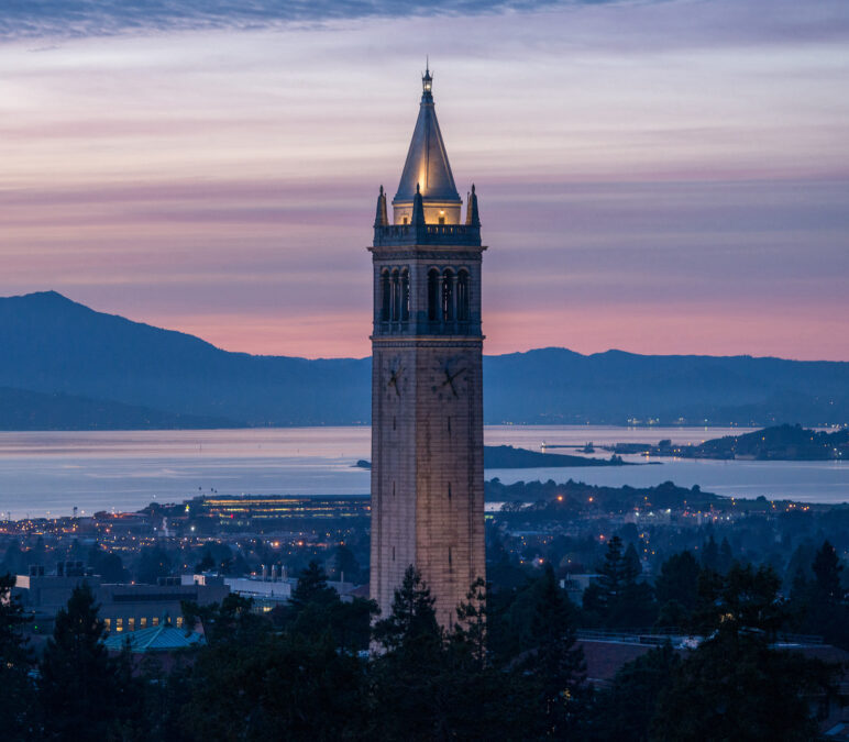 A view of the Campanile awash in the purples and pinks of a sunset.