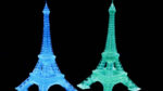 Photo of Eiffel Tower-shaped luminescent structures 3D-printed from supramolecular ink. Each 2-centimeter-tall device is fabricated from supramolecular ink that emits blue or green light when exposed to 254-nanometer ultraviolet light.