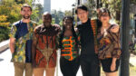 Photo showing members of the MDevEng community wearing colorful SHE 4 Change clothing, featuring African prints.