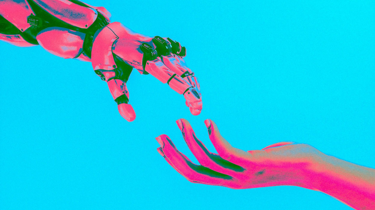A pink robot hand and a pink human hand reach for each other against a blue background.