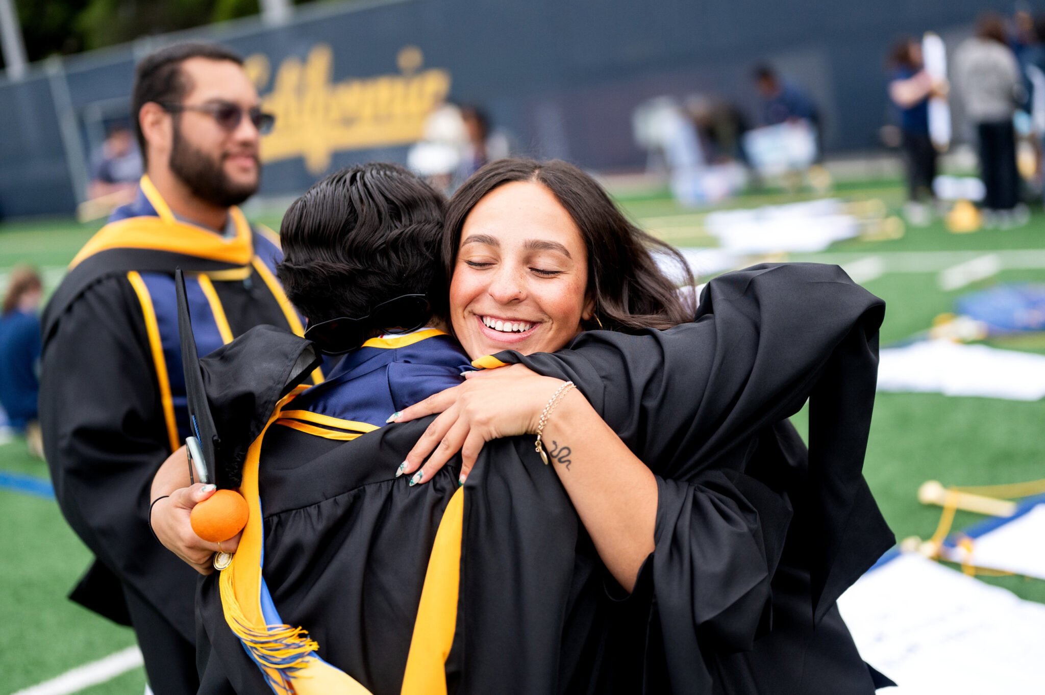 Graduates hug at Maxwell Field