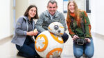 Oliver O’Reilly, Theresa Honein, Jessica "Psy" DeLacy and a replica BB-8 robot.