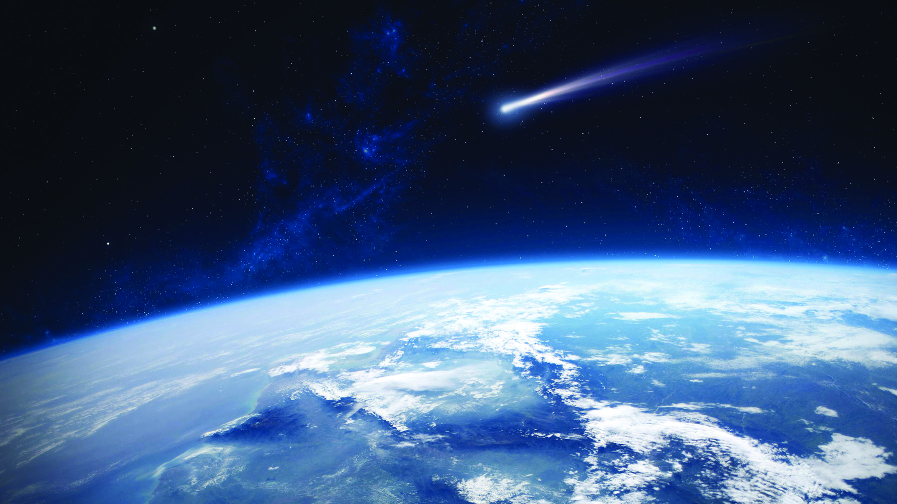Bright object with fiery trail approaching curve of Earth in image from space
