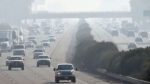 Traffic moves along 99 south in Fresno, Calif.